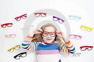 Child at eye sight test. Kid at optitian. Eyewear for kids.