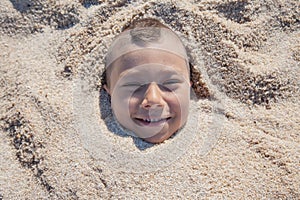 Child Face Buried Sand