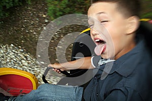 Child in fairground ride photo