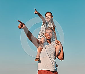 child family outdoor man father girl happy happiness lifestyle having fun bonding piggyback daughter