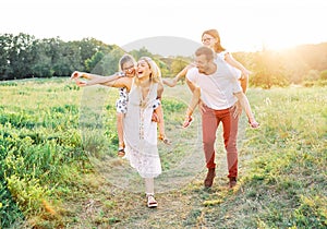child family outdoor mother woman father girl happy happiness lifestyle having fun bonding piggyback