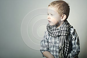 Child. Fashionable Funny little Boy in Scurf. Fashion Children