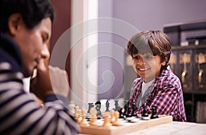 Child, father and chess game or thinking checkmate together for winning pawn, knight or queen. Son, man and board