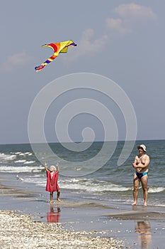 Child and father at the sea side