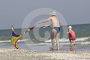 Child and father at the sea side