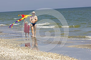 Child and father at the sea side