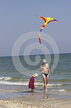 Child and father at the sea side