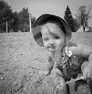 Child with feather on beach