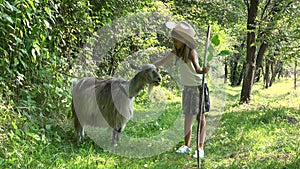 Child Feeding Goat in Courtyard, Farmer Cowboy Kid Pasturing Animals in Field, Rustic Girl with Animals in Garden