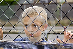 Child through fence img
