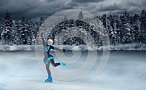 Child  figure skater on winter lake  background