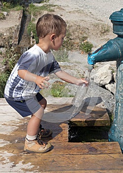 Child filling water bottle