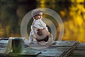 Child fishing at autumn lake