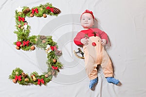 The child is five months old. 5 months old cute baby portrait. 5 digit offspring. Happy Baby Boy, Smiling Infant Kid Portrait,
