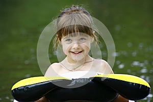 Child floating on a inner tube