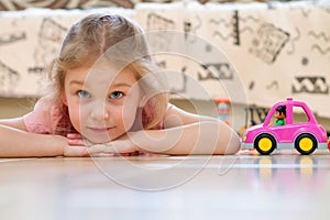 Child on the floor with toys