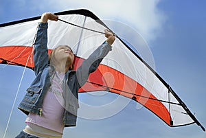 Child flying with a kite photo