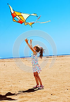 Kid flying kite outdoor.