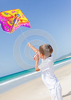 Child flying kite beach outdoor.