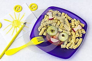 Child food. Funny food. Plate with pasta