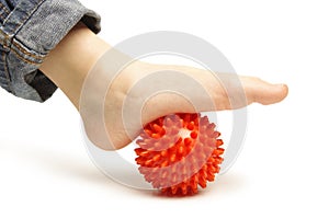 Child foot with plastic massage ball
