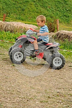 Child on four wheeler