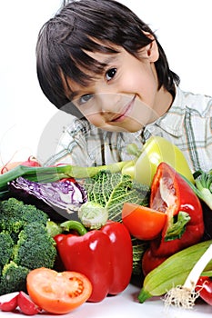 Child and fresh vegetables