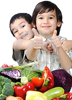 Child and fresh vegetables