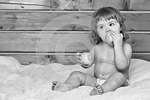 Child with fruit. Boy eating apples