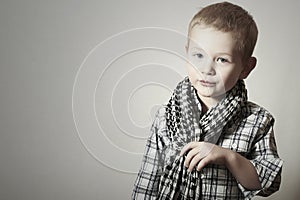Child. funny little boy in scurf. Fashion Children. 4 years old. plaid shirt photo