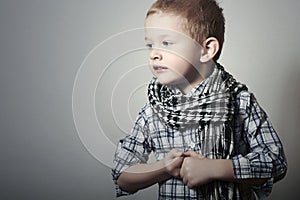 Child. funny little boy in scurf. Fashion Children. 4 years old. plaid shirt