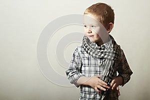 Child. funny little boy in scurf. Fashion Children. 4 years old. plaid shirt photo