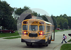 Child Getting on School Bus