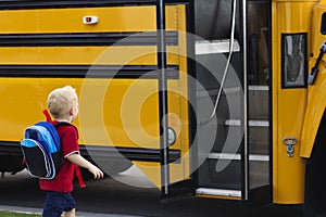 Child getting on a school bus