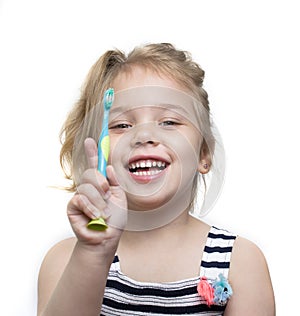 Child girl brush her teeth on white background.Toddler dental concept.Tooth hygiene. Toothbrush