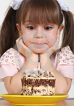 Child girl and cake photo