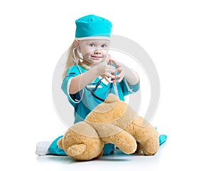 Child girl with clothes of doctor playing toy