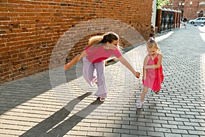 Child girl with cochlear implant with her mother spend time outdoor. Hear impairment and deaf community concept. Deaf