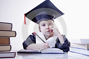 Child girl college graduate thinking about her perspectiv and future job. Humorous photo. Knowledge, studies, work, career