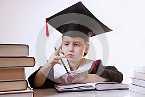 Child girl college graduate thinking about her perspectiv and future job. Humorous photo. (Knowledge, studies, work, career