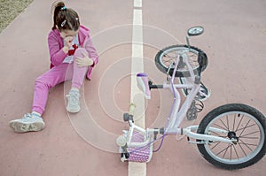 Child girl crying after bike accident