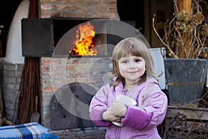 Child girl with a cup of tea