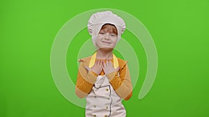 Child girl dressed cook chef baker waving hands, asking to follow or join, welcome, hello hi gesture