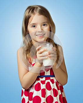 Child girl drink hold glass milk isolated on blue background.