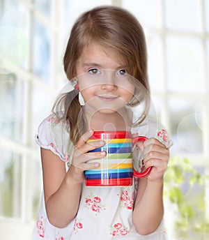 Child girl drink mug morning tea healthy lifestyle.