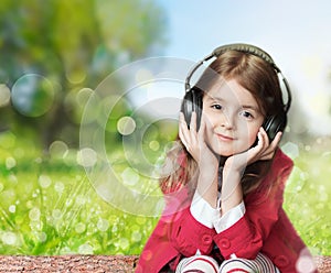 Child girl earphones outdoor empty space background.