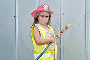 Child girl in fireman costume