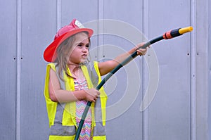 Child girl in fireman costume