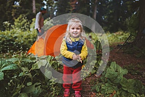 Child girl in forest traveling family camping tent gear adventure vacations hiking outdoor in forest