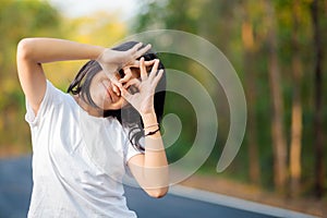 Child girl gesture hands as binoculars, future concept